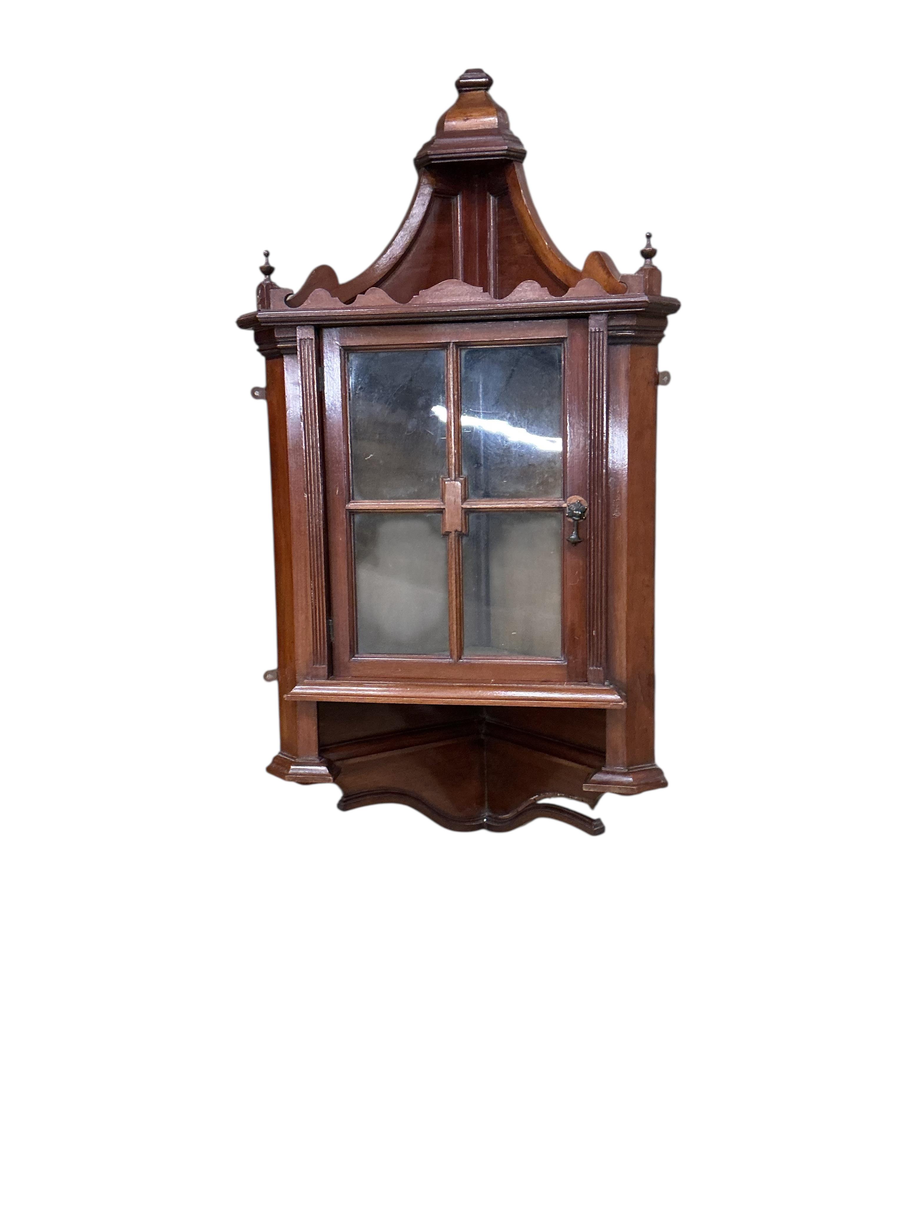 A pair of small late Victorian mahogany hanging corner cabinets, width 48cm, depth 26cm, height 96cm